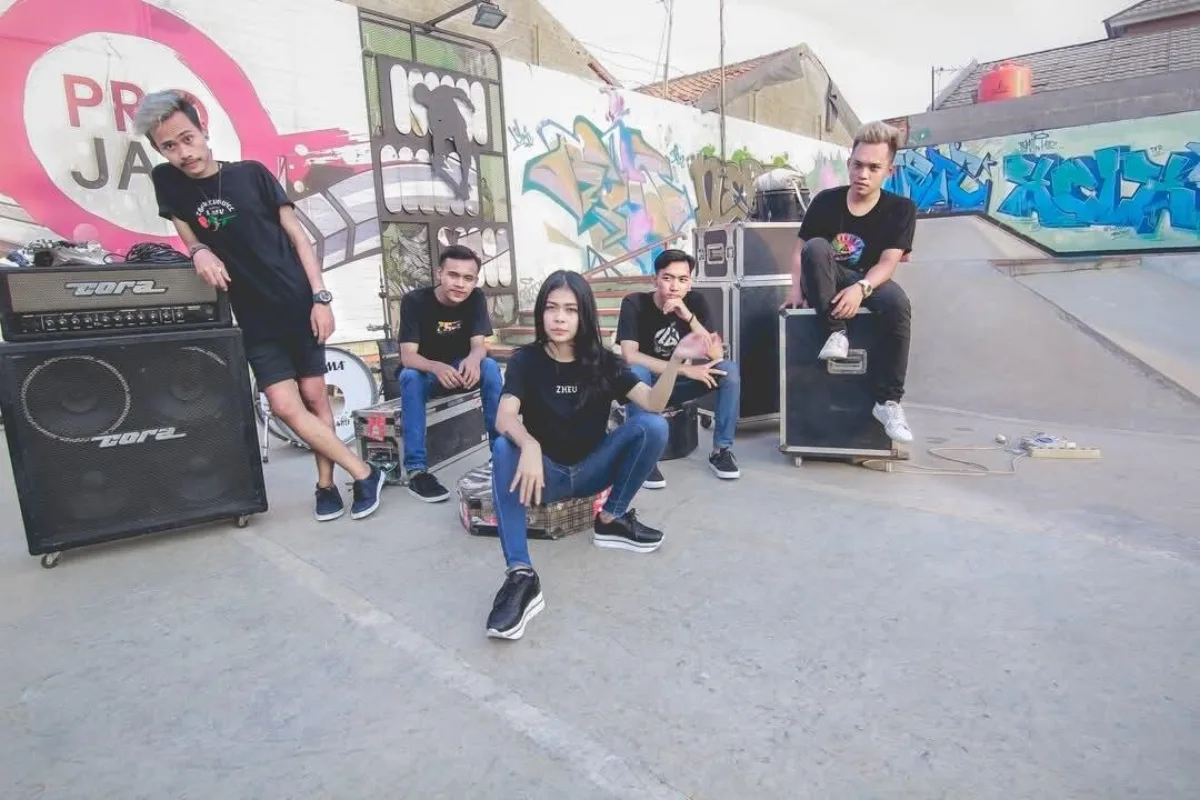A five-piece band from the DWS Record roster at a graffiti-covered skate park
